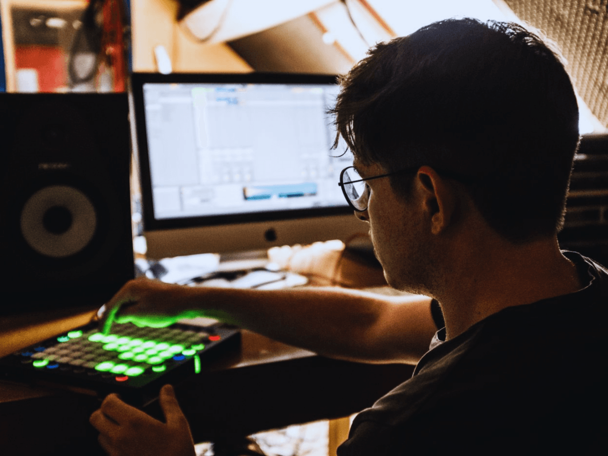Young organiser with laptop at event venue